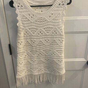 Another Love crochet sleeveless top with fringe at the bottom.